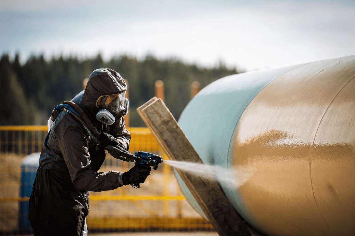 OgreKote industrial coating being applied to oil and gas pipeline